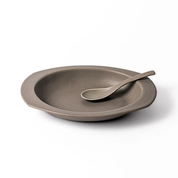 Gray Japanese oval ceramic curry plate with wide rim and raised sides for serving rice curry or stew.