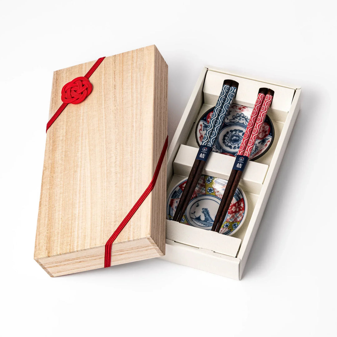Japanese Edo-style chopsticks and sauce dish set featuring red and blue patterns with playful dinosaur motif gift box.