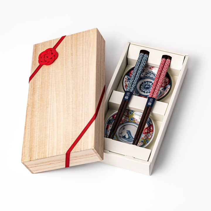 Japanese Edo-style chopsticks and sauce dish set featuring red and blue patterns with playful dinosaur motif gift box.