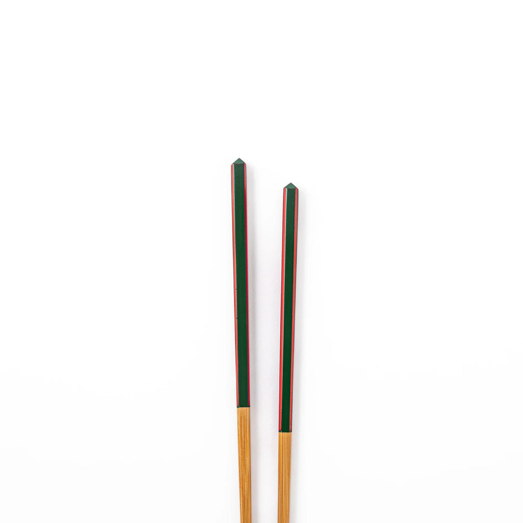 Fine tip Japanese bamboo chopsticks featuring a green handle with red accents and a natural bamboo finish