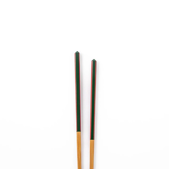 Fine tip Japanese bamboo chopsticks featuring a green handle with red accents and a natural bamboo finish