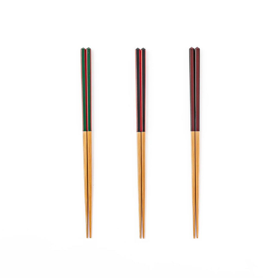 Fine tip Japanese bamboo chopsticks in green black and wine red with vibrant stripes and a natural bamboo finish