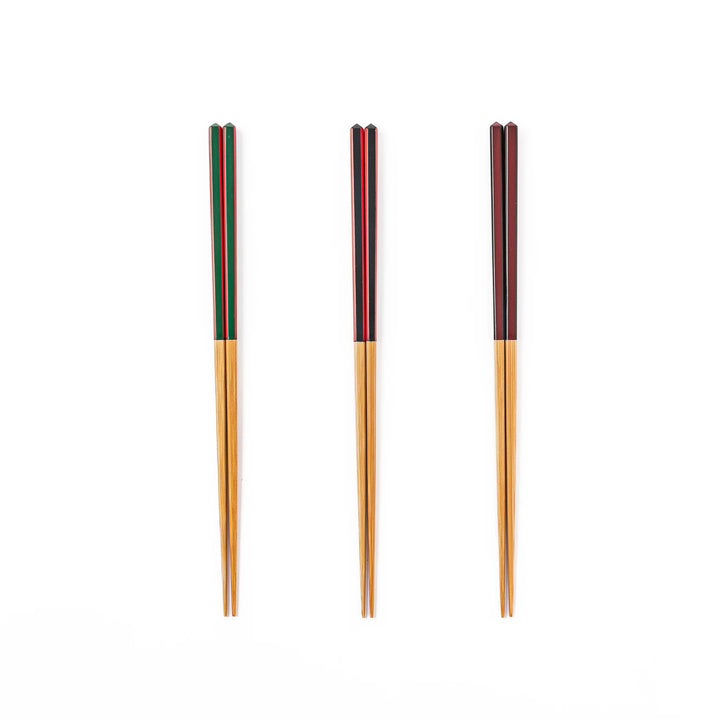 Fine tip Japanese bamboo chopsticks in green black and wine red with vibrant stripes and a natural bamboo finish