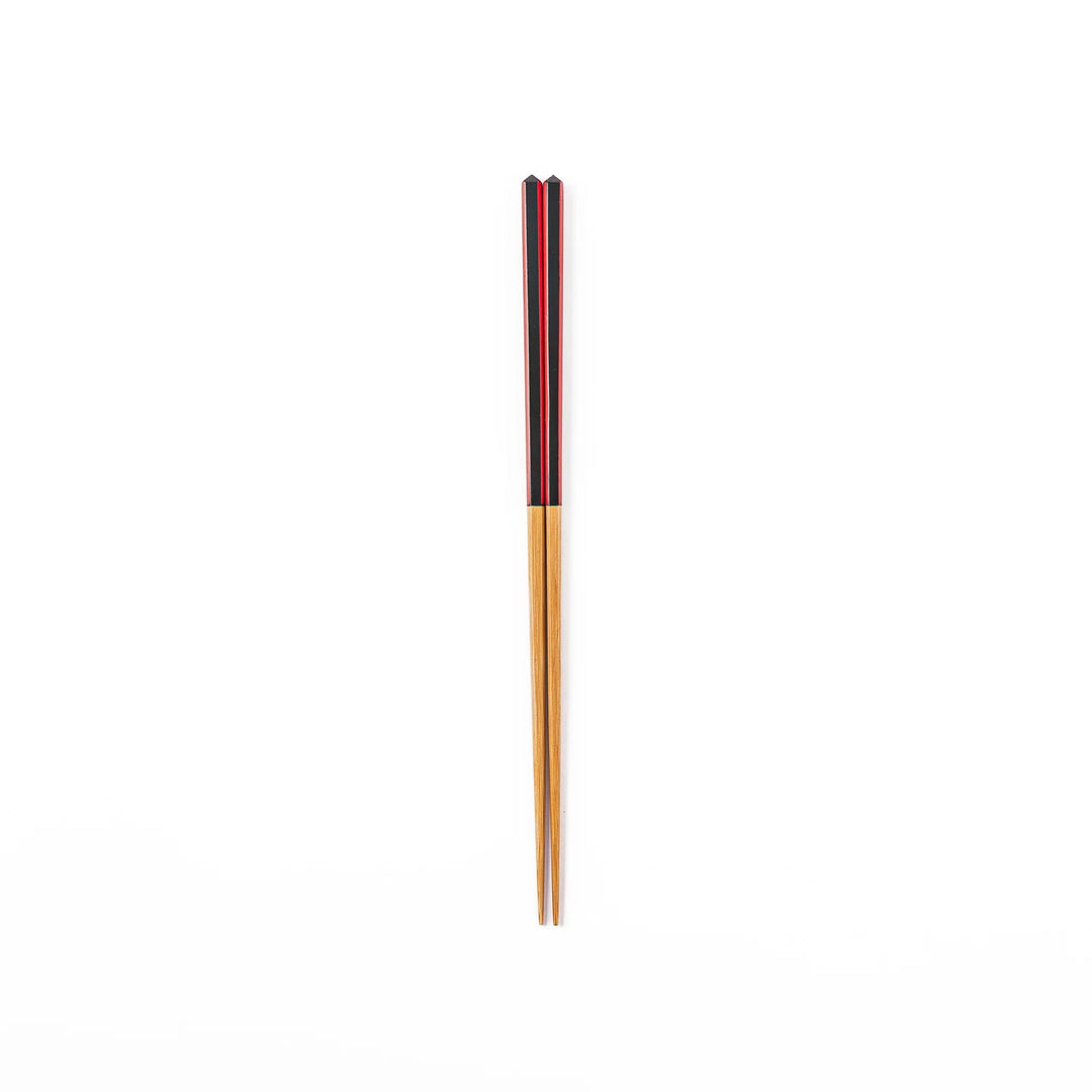 Fine tip Japanese bamboo chopsticks featuring a black handle with bold red side stripes and a natural bamboo finish