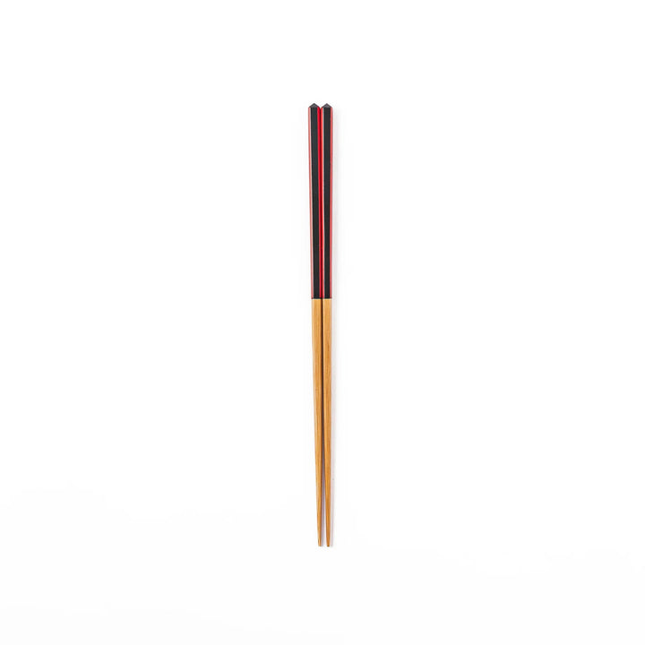 Fine tip Japanese bamboo chopsticks featuring a black handle with bold red side stripes and a natural bamboo finish