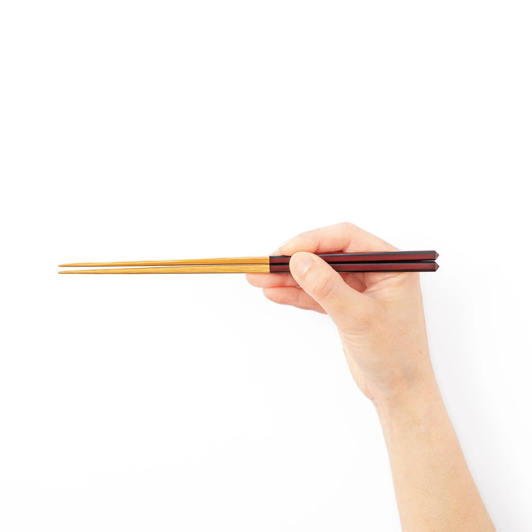 Fine tip Japanese bamboo chopsticks featuring a wine red handle with dark side stripes and a natural bamboo finish