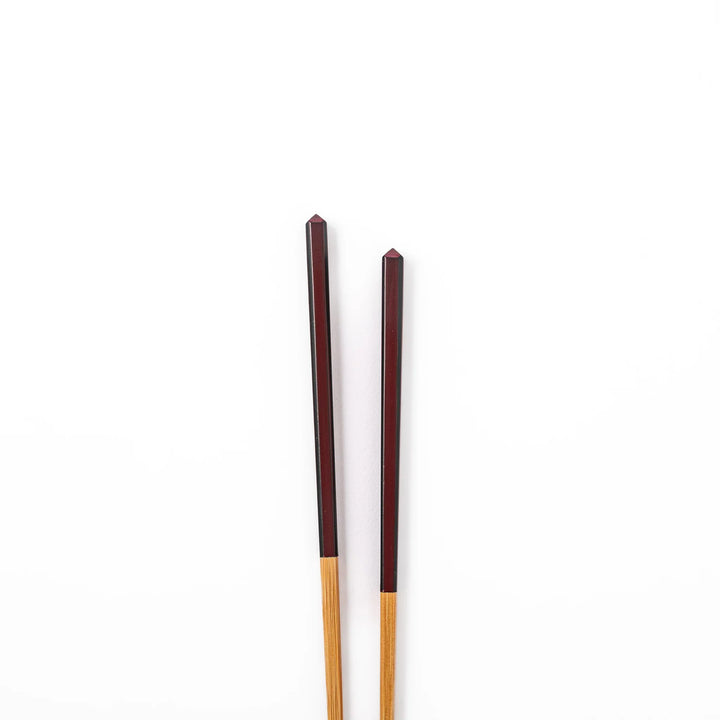Fine tip Japanese bamboo chopsticks featuring a wine red handle with dark side stripes and a natural bamboo finish