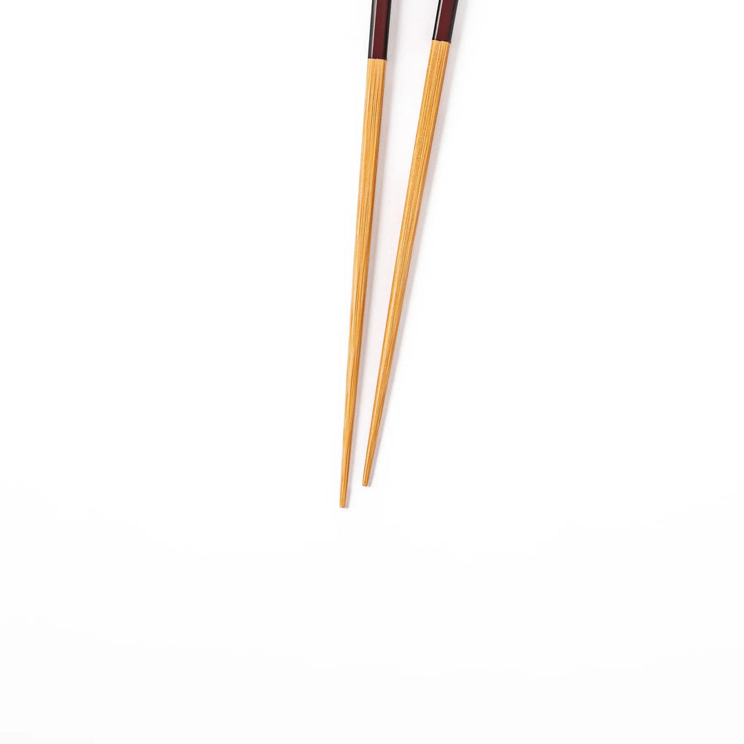 Fine tip Japanese bamboo chopsticks featuring a wine red handle with dark side stripes and a natural bamboo finish