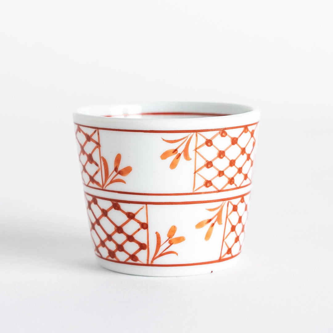 A condiment bowl featuring a geometric pattern of flowers within triangles, available in blue or red ink.