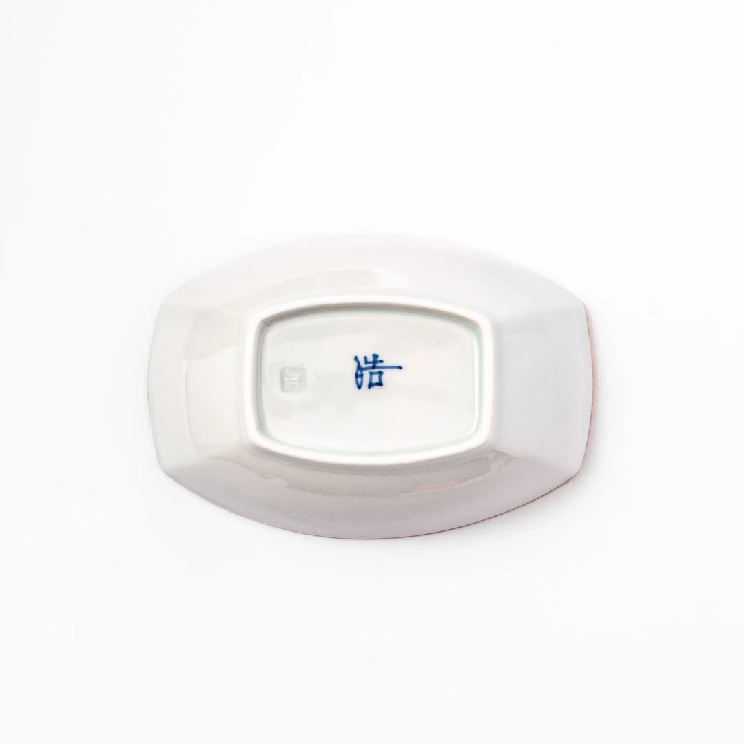 White boat-shaped bowl with blue floral patterns on the inner rim and a rustic brown edge, perfect for cereal or side dishes.