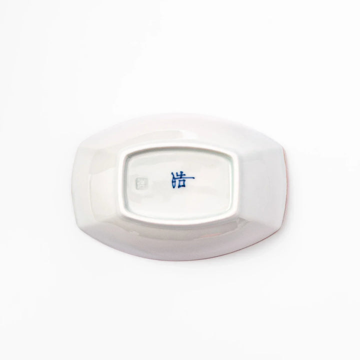 White boat-shaped bowl with blue floral patterns on the inner rim and a rustic brown edge, perfect for cereal or side dishes.