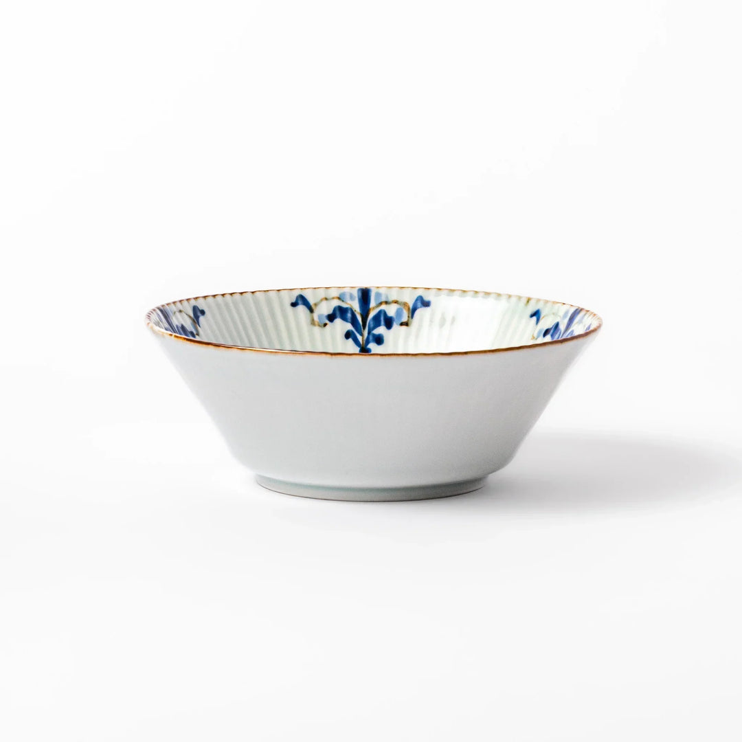 Ridged white bowl with blue floral designs around the inner rim and a brown edge, perfect for cereal, soup, or salad. 