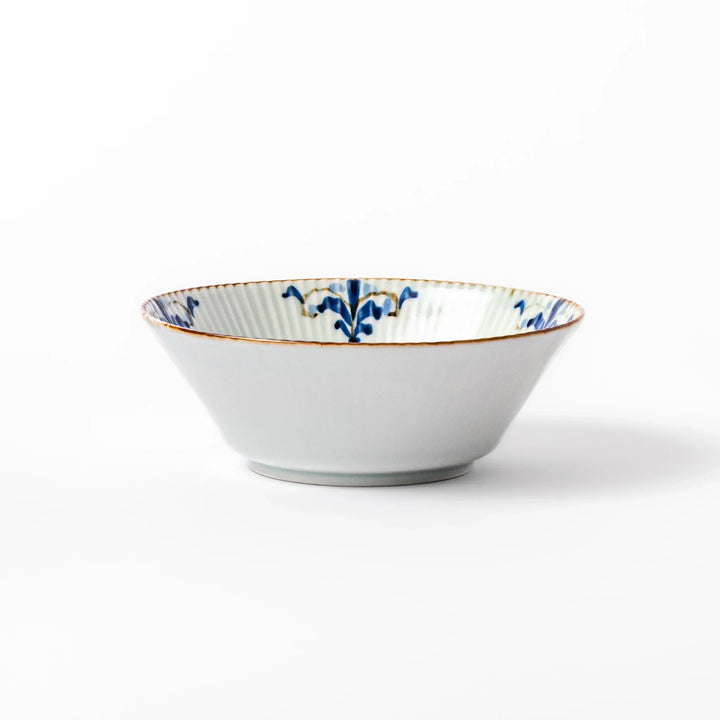 Ridged white bowl with blue floral designs around the inner rim and a brown edge, perfect for cereal, soup, or salad. 