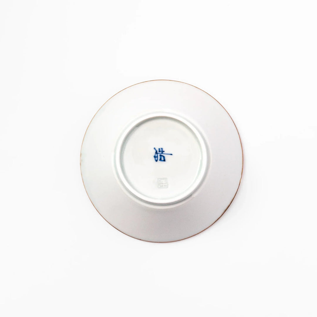 White dessert bowl with vertical ridges, blue floral accents, and brown rim, ideal for serving sweets or fruits.