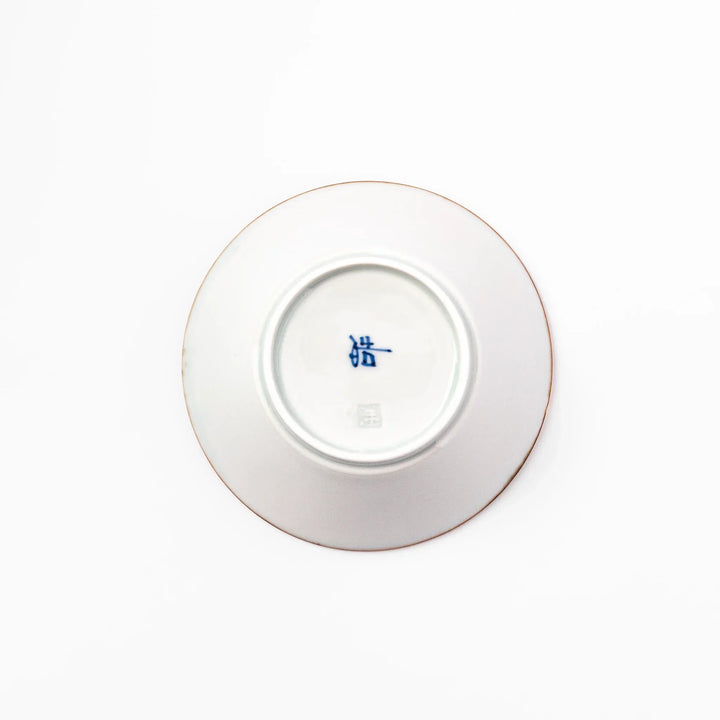 White dessert bowl with vertical ridges, blue floral accents, and brown rim, ideal for serving sweets or fruits.