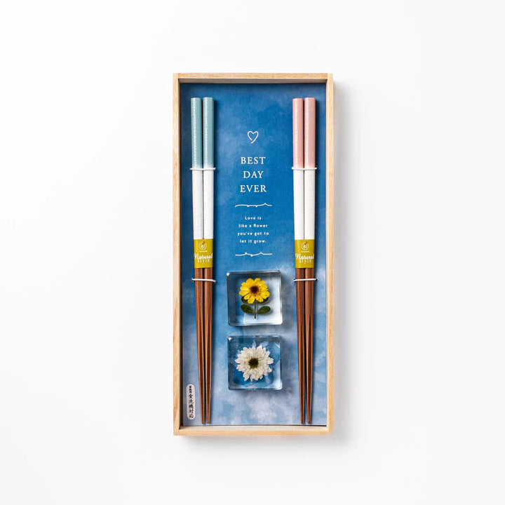 Floral-themed Japanese chopsticks gift set with pastel handles and clear rests featuring pressed sunflower and daisy.