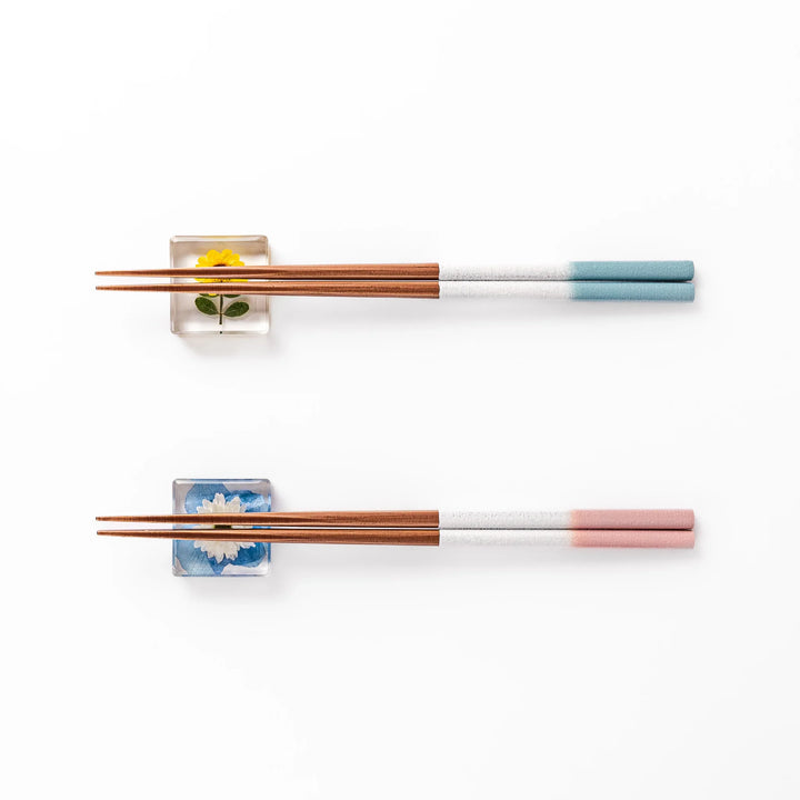 Floral-themed Japanese chopsticks gift set with pastel handles and clear rests featuring pressed sunflower and daisy.