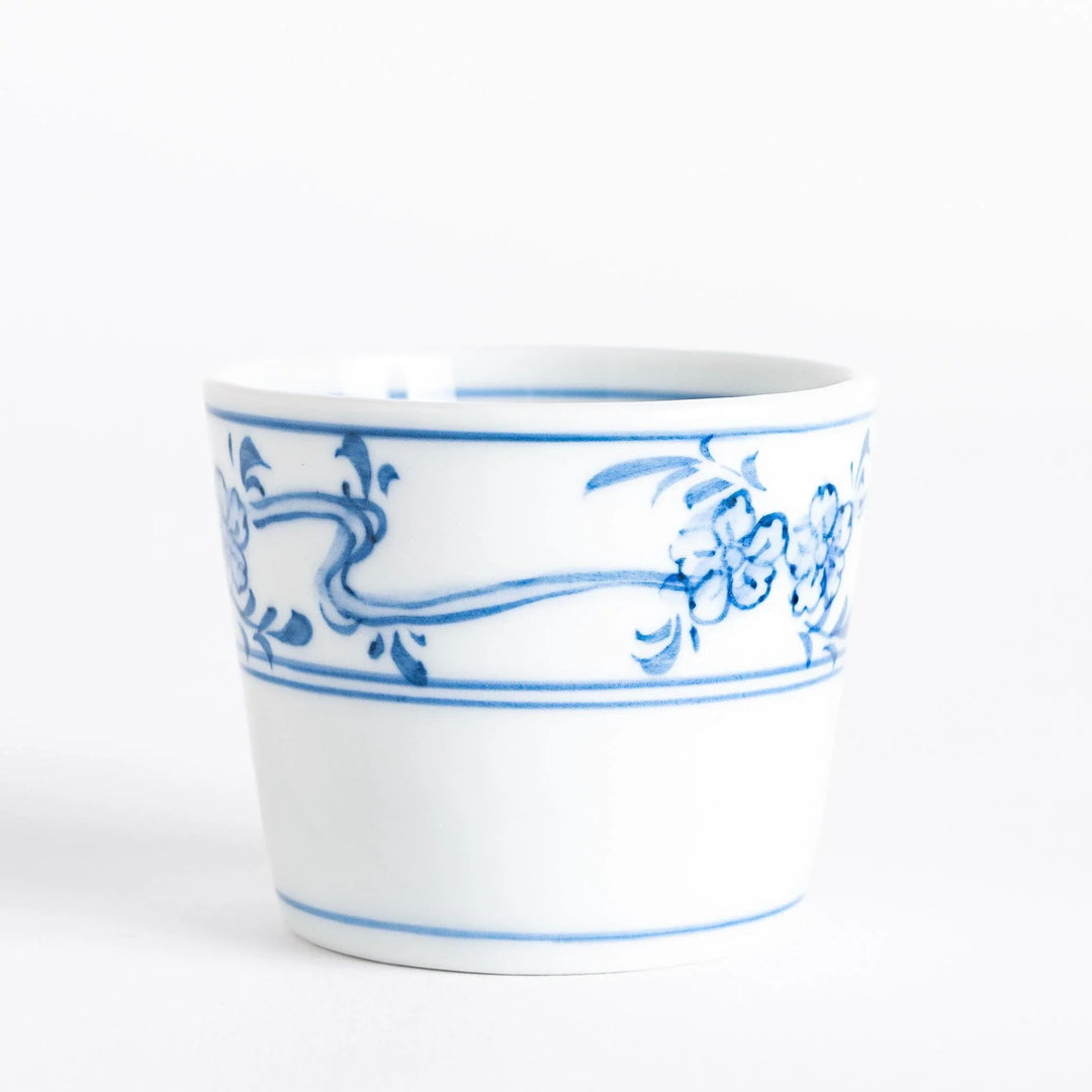 A small bowl with delicate blue floral designs flowing along the surface, perfect for condiments or small servings.