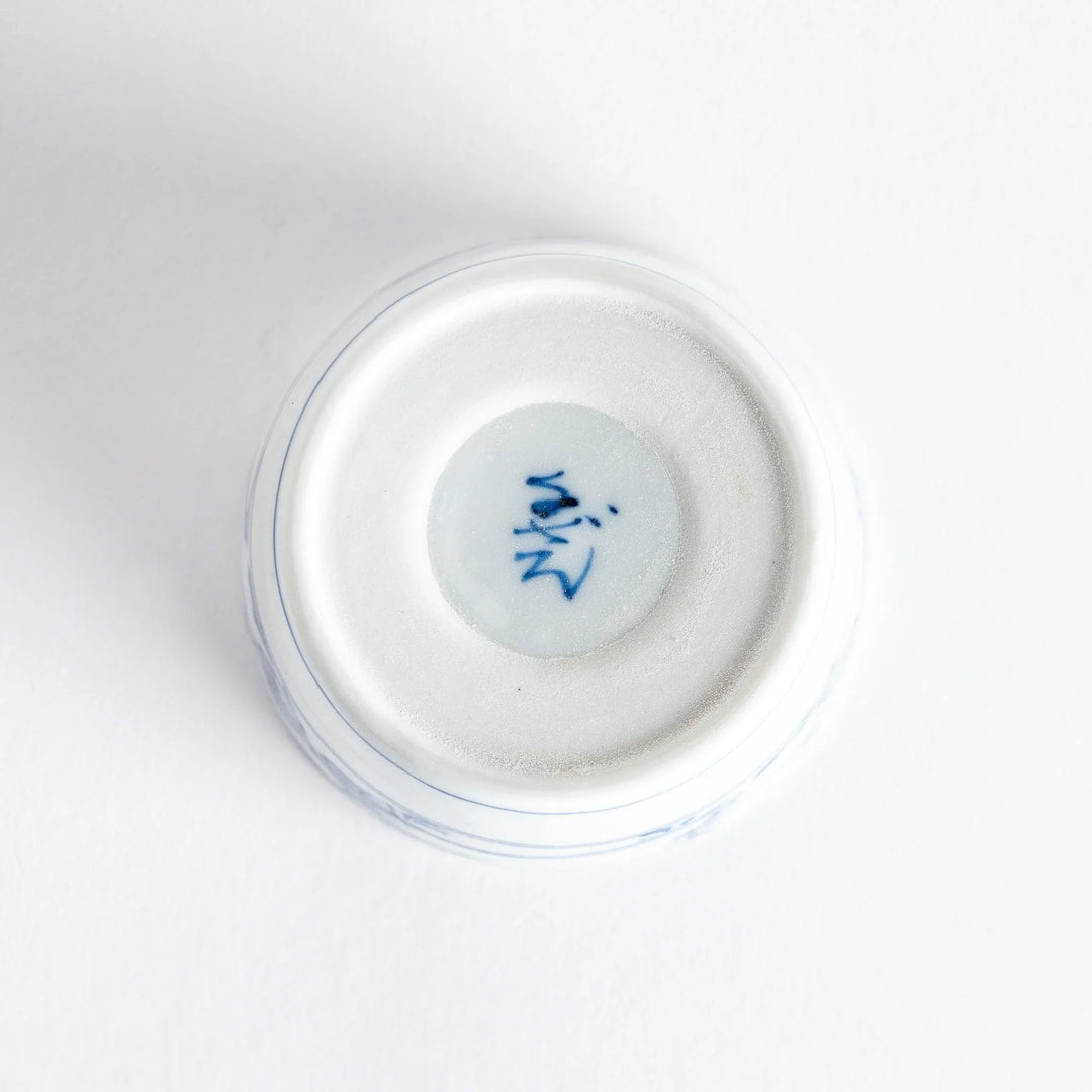 A small bowl with delicate blue floral designs flowing along the surface, perfect for condiments or small servings.