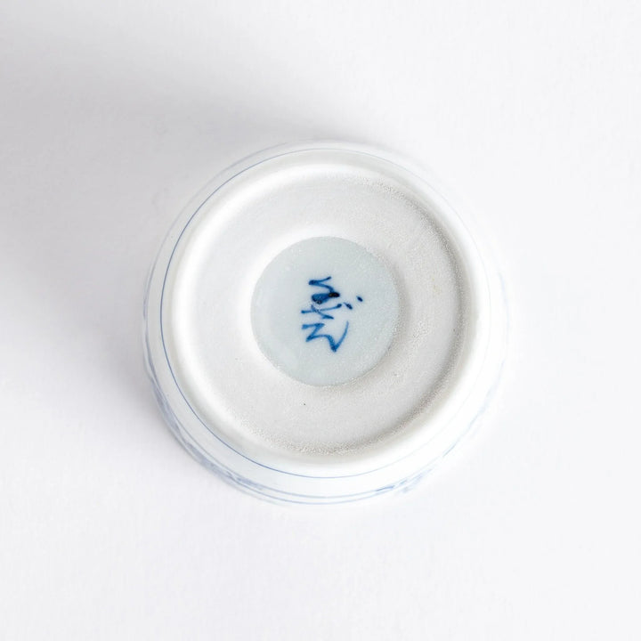 A small bowl with delicate blue floral designs flowing along the surface, perfect for condiments or small servings.