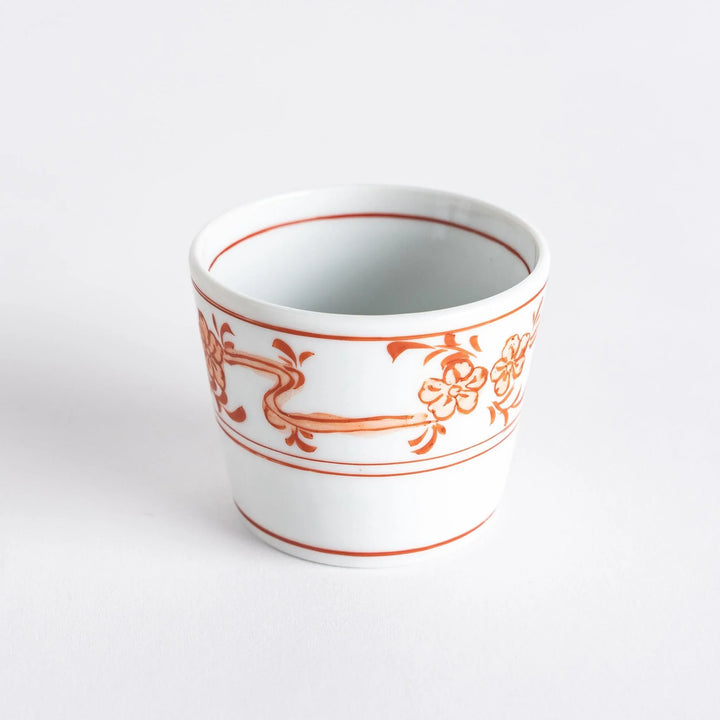 A small bowl with delicate blue floral designs flowing along the surface, perfect for condiments or small servings.