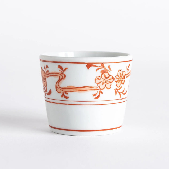 A small bowl with delicate blue floral designs flowing along the surface, perfect for condiments or small servings.