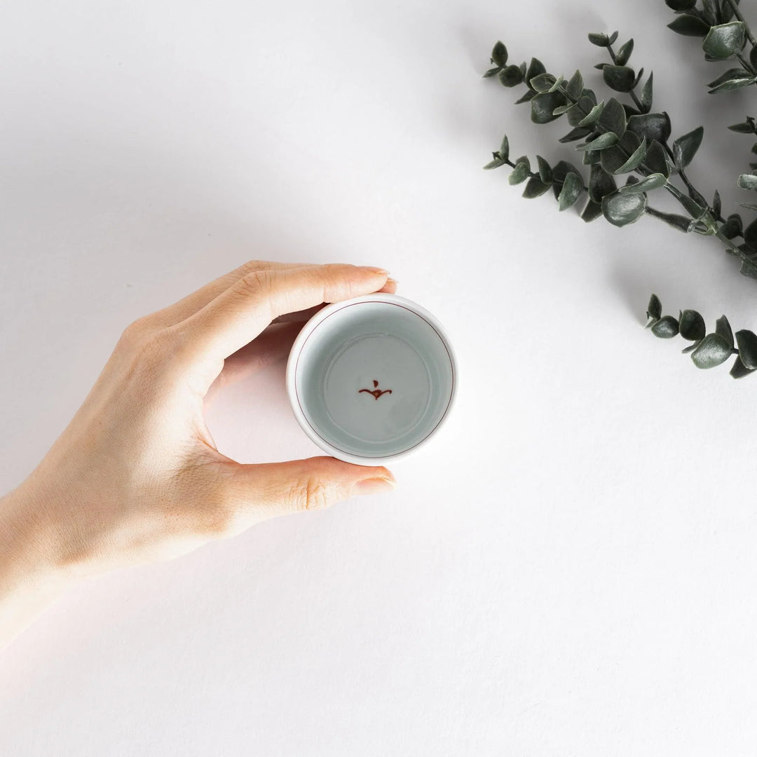 A small bowl with delicate blue floral designs flowing along the surface, perfect for condiments or small servings.