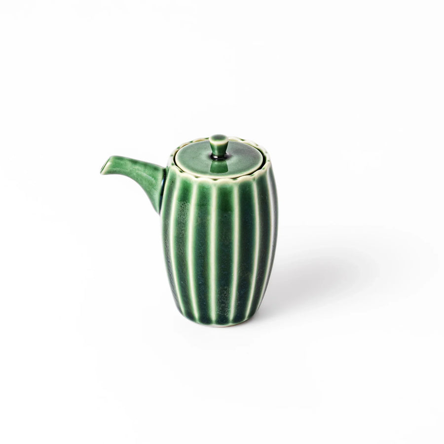 Mino ware soy sauce dispenser with forest-green glaze and drip-free spout, blending beauty and function.