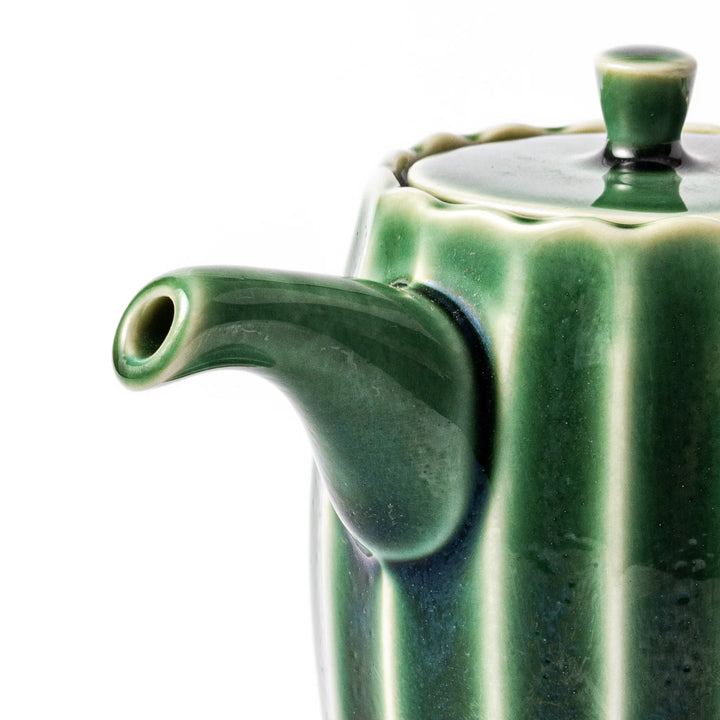 Mino ware soy sauce dispenser with forest-green glaze and drip-free spout, blending beauty and function.