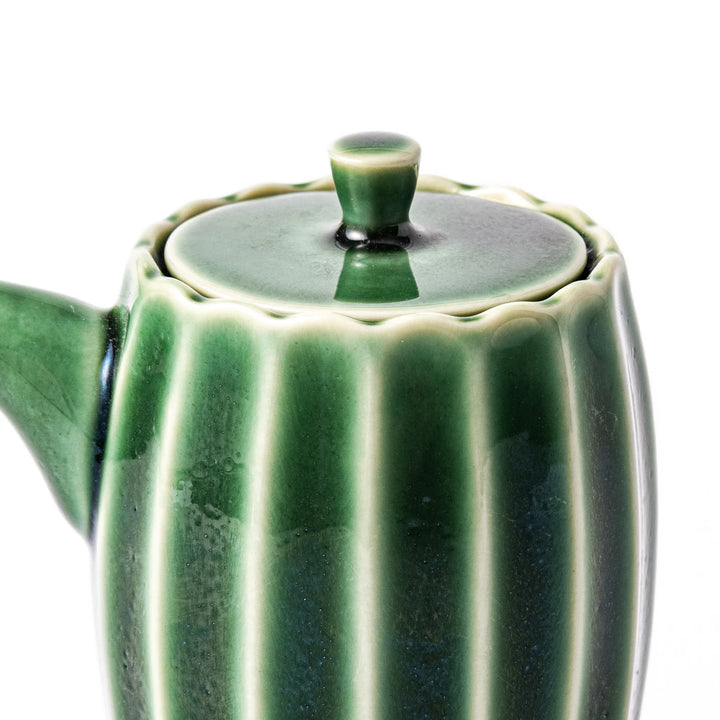 Mino ware soy sauce dispenser with forest-green glaze and drip-free spout, blending beauty and function.