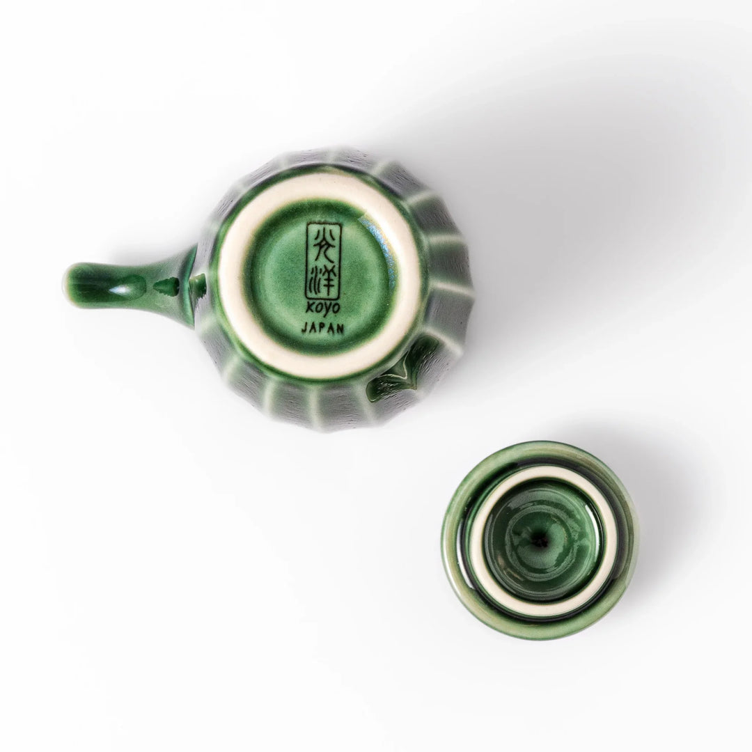 Mino ware soy sauce dispenser with forest-green glaze and drip-free spout, blending beauty and function.