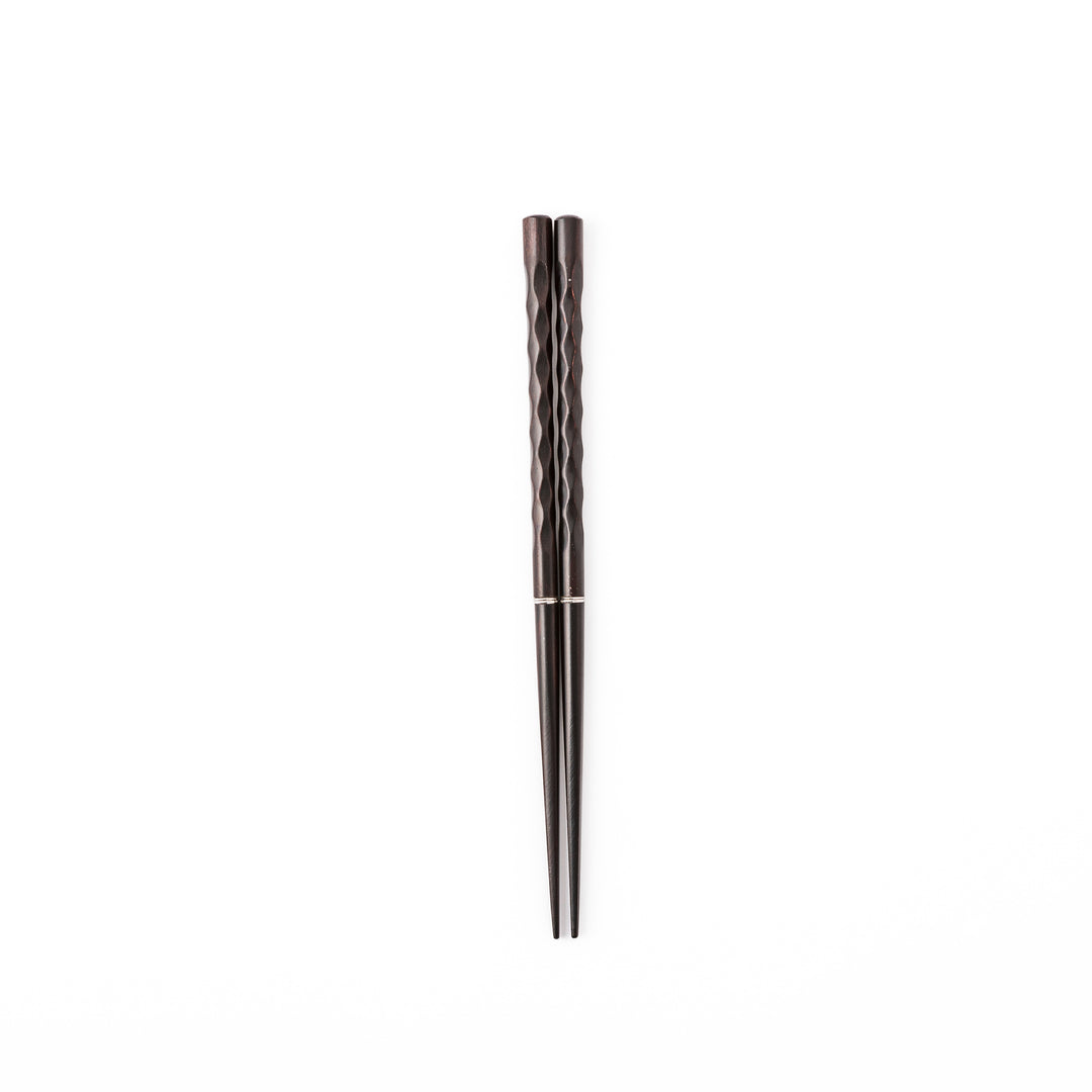 Gentle Wave portable Japanese travel chopsticks carved from dark natural wood showing a textured wavy design