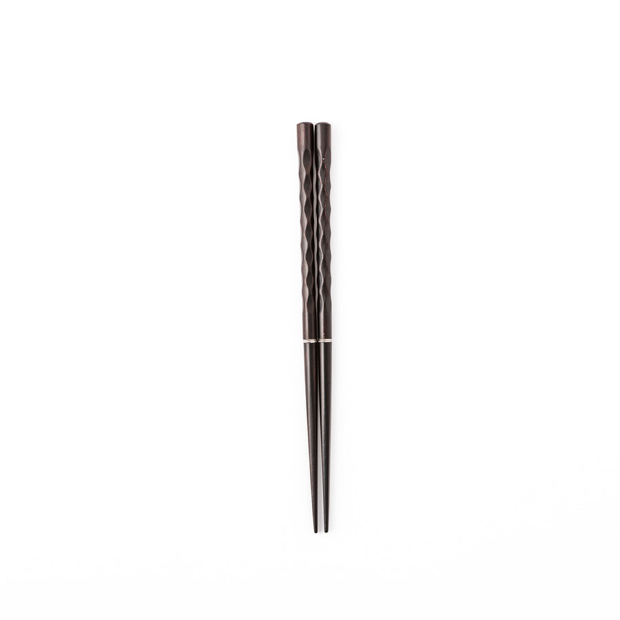 Gentle Wave portable Japanese travel chopsticks carved from dark natural wood showing a textured wavy design