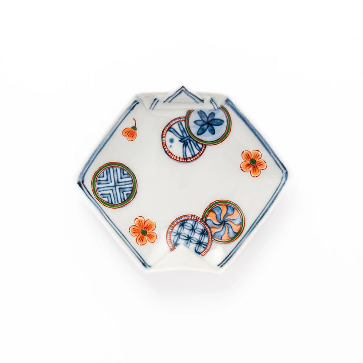 Japanese porcelain origami shaped sauce dish with geometric and floral motifs for soy sauce or condiments.