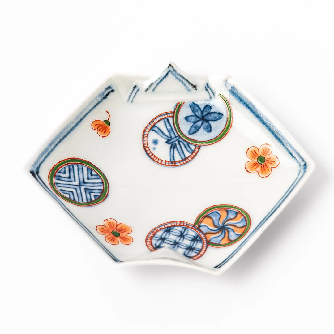 Japanese porcelain origami shaped sauce dish with geometric and floral motifs for soy sauce or condiments.