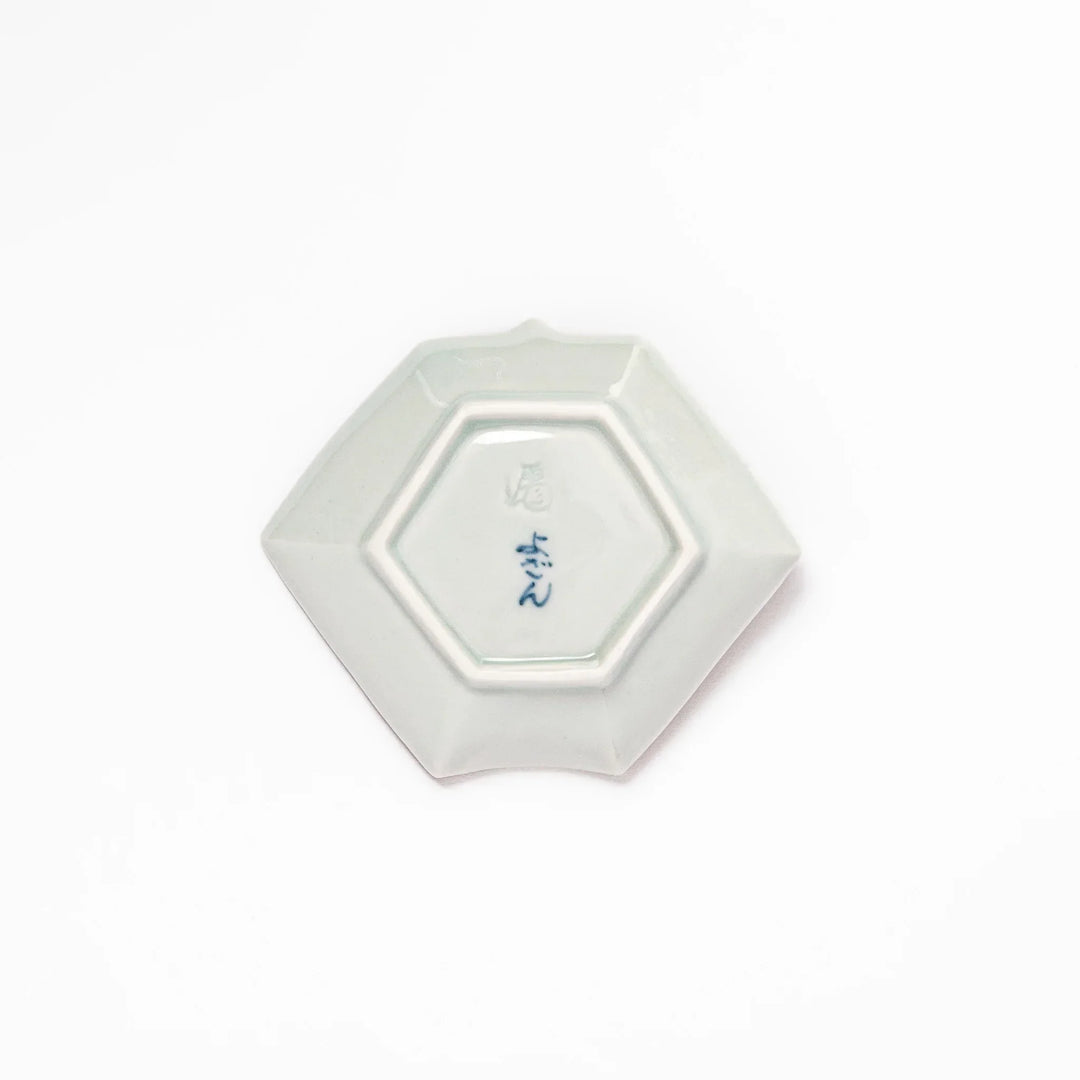 Japanese porcelain origami shaped sauce dish with geometric and floral motifs for soy sauce or condiments.