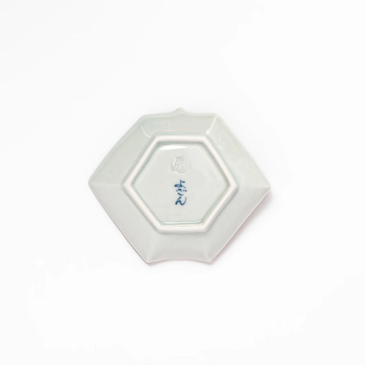 Japanese porcelain origami shaped sauce dish with geometric and floral motifs for soy sauce or condiments.
