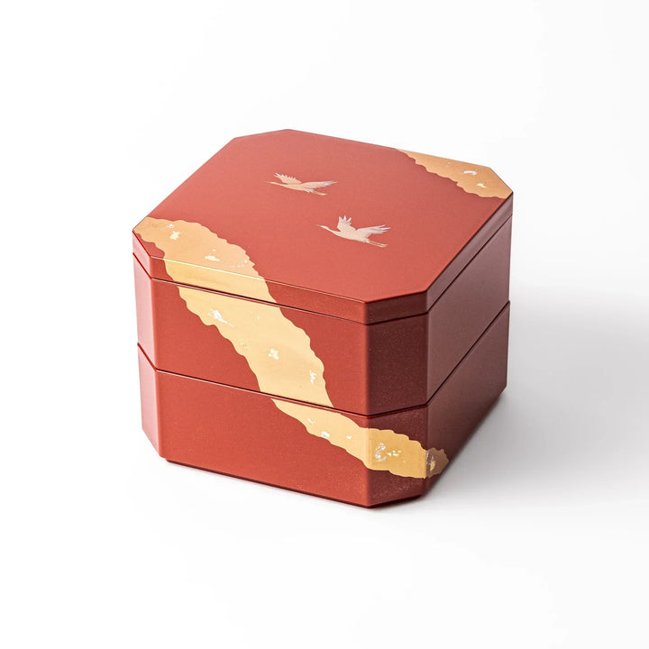 Gold River and Crane Japanese hexagonal jubako box with gold motif on red lacquer for festive food display.