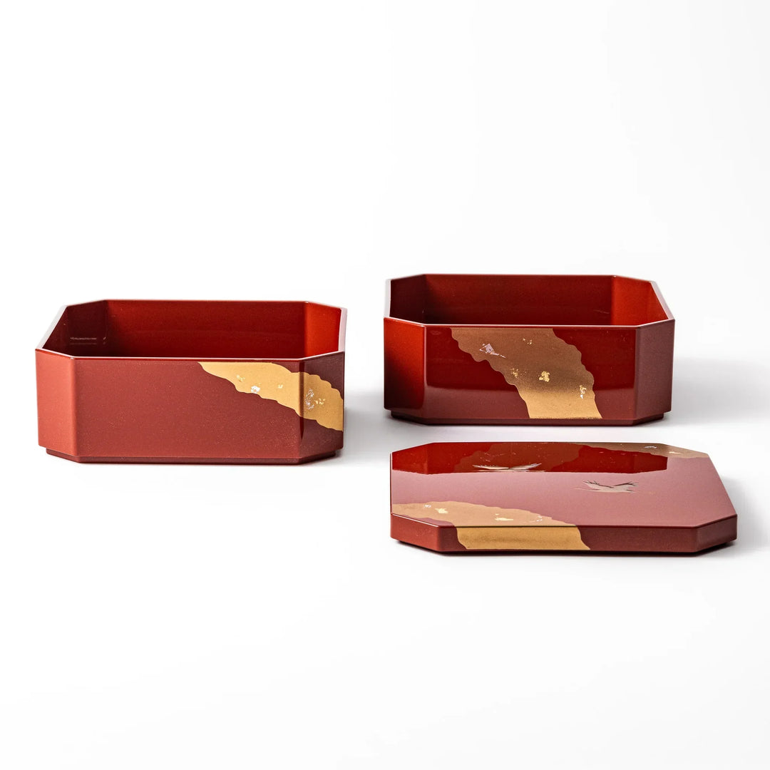 Gold River and Crane Japanese hexagonal jubako box with gold motif on red lacquer for festive food display.