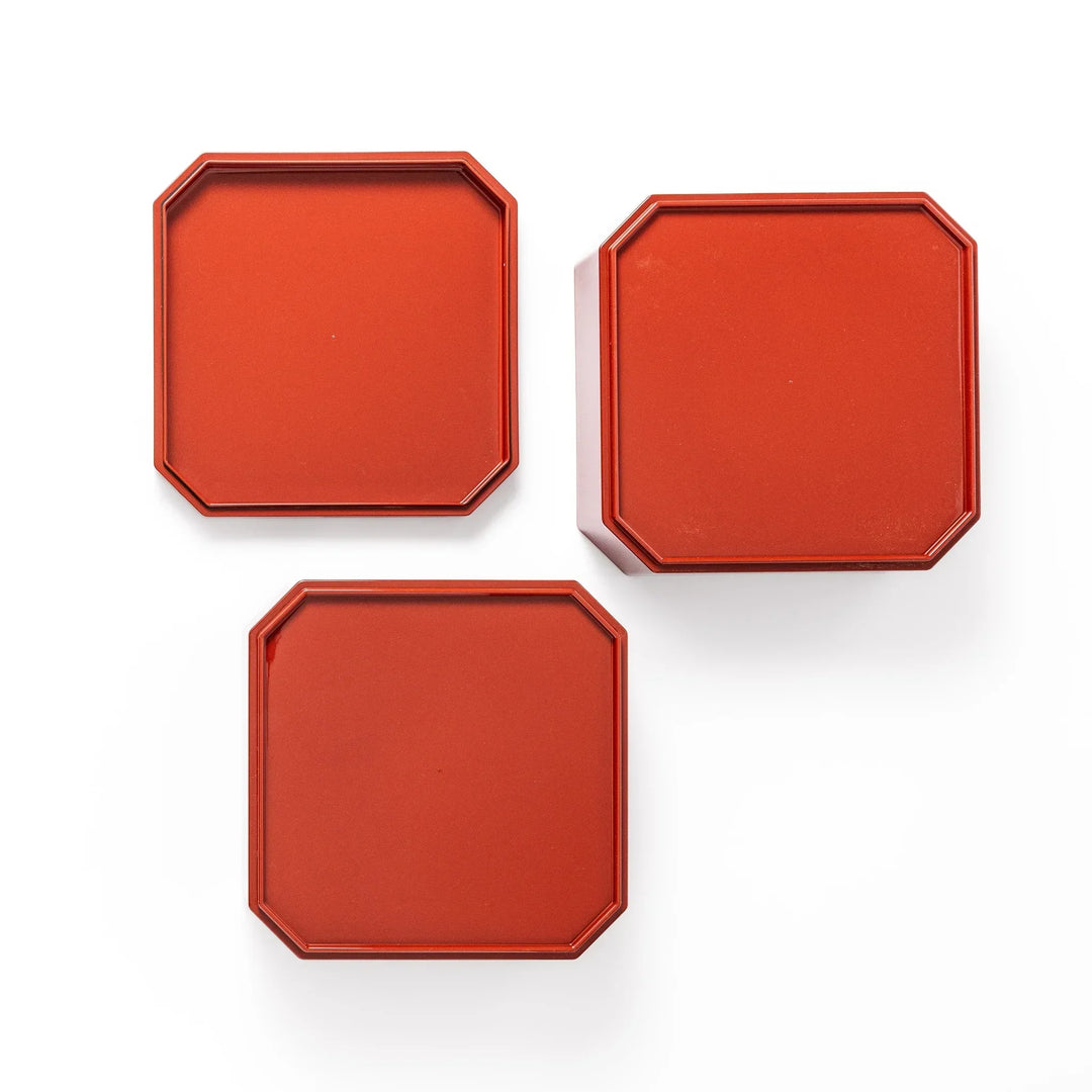 Gold River and Crane Japanese hexagonal jubako box with gold motif on red lacquer for festive food display.