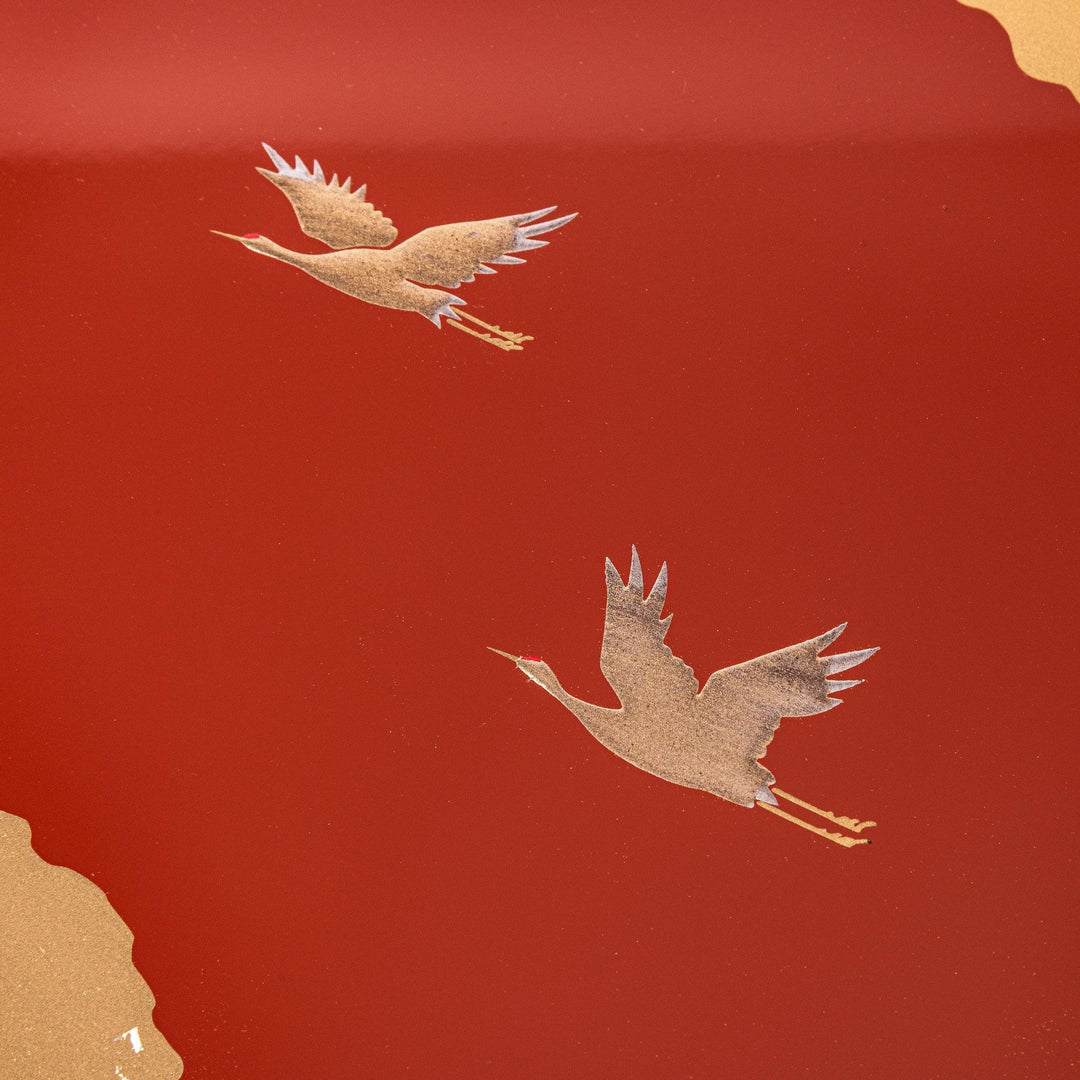 Gold River and Crane Japanese hexagonal jubako box with gold motif on red lacquer for festive food display.