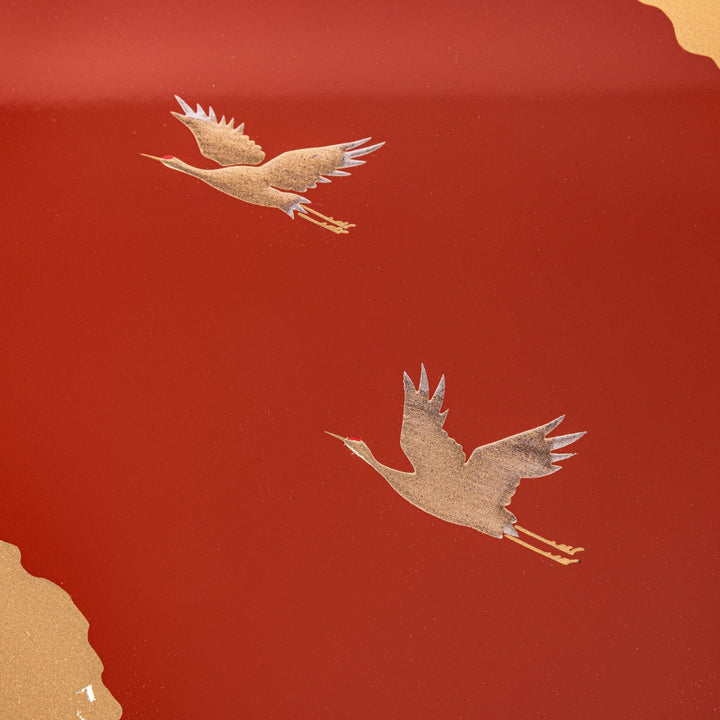 Gold River and Crane Japanese hexagonal jubako box with gold motif on red lacquer for festive food display.