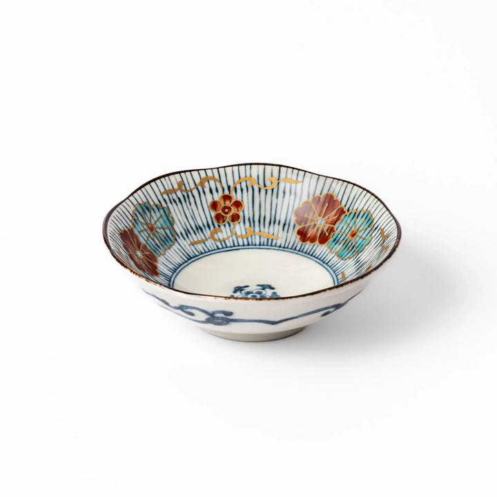 Scalloped Japanese dessert bowl with blue stripes red and teal floral motifs and gold accents for sweets or sides.