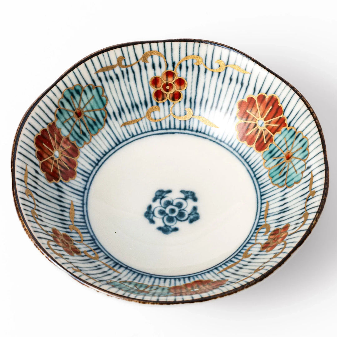 Scalloped Japanese dessert bowl with blue stripes red and teal floral motifs and gold accents for sweets or sides.