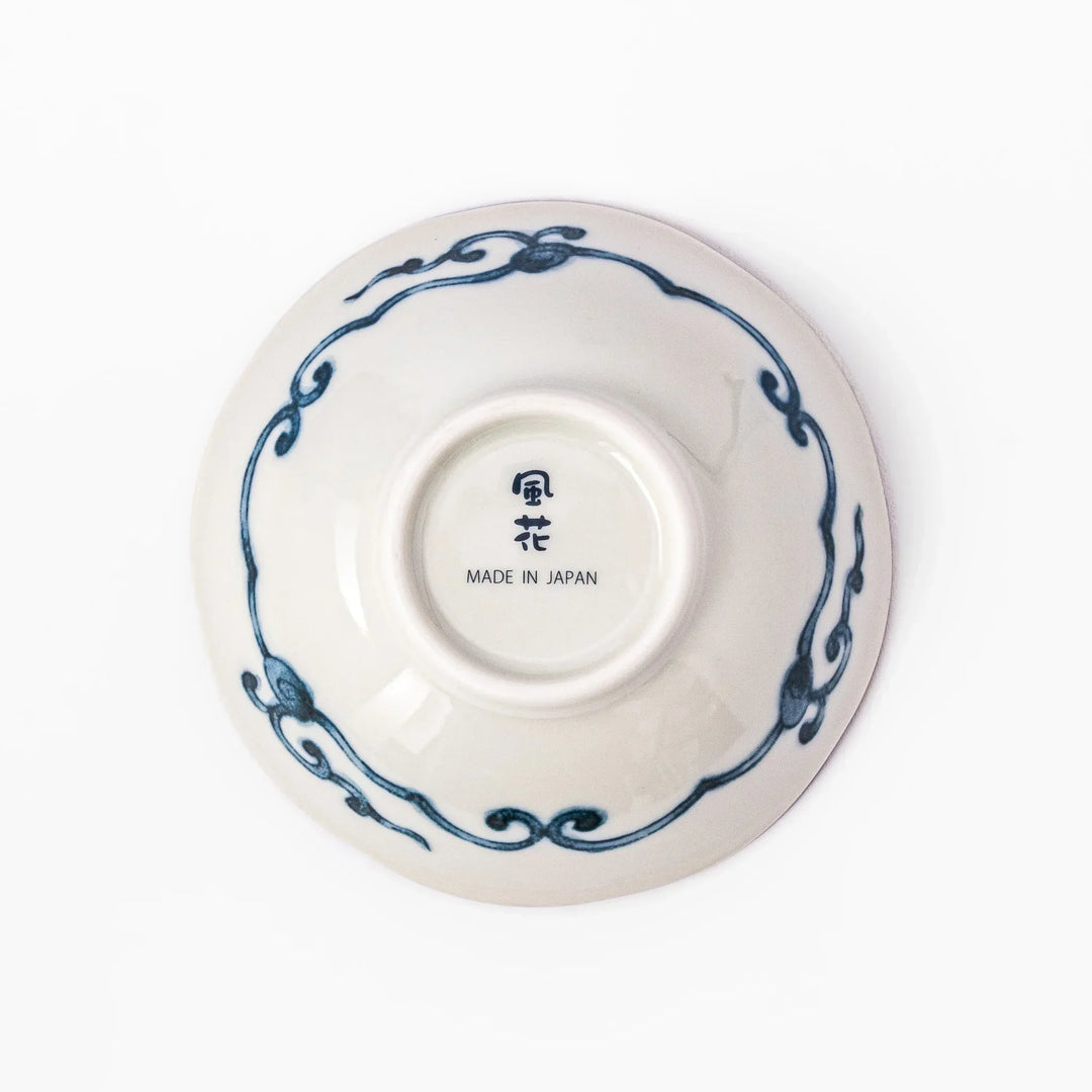 Scalloped Japanese dessert bowl with blue stripes red and teal floral motifs and gold accents for sweets or sides.