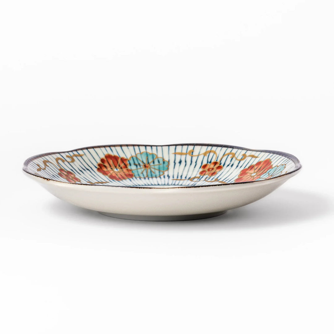 Scalloped Japanese dessert plate with blue stripes red teal and gold floral motifs perfect for small treats.