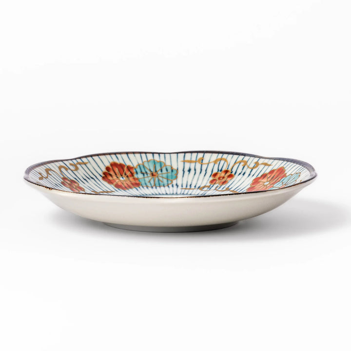 Scalloped Japanese dessert plate with blue stripes red teal and gold floral motifs perfect for small treats.