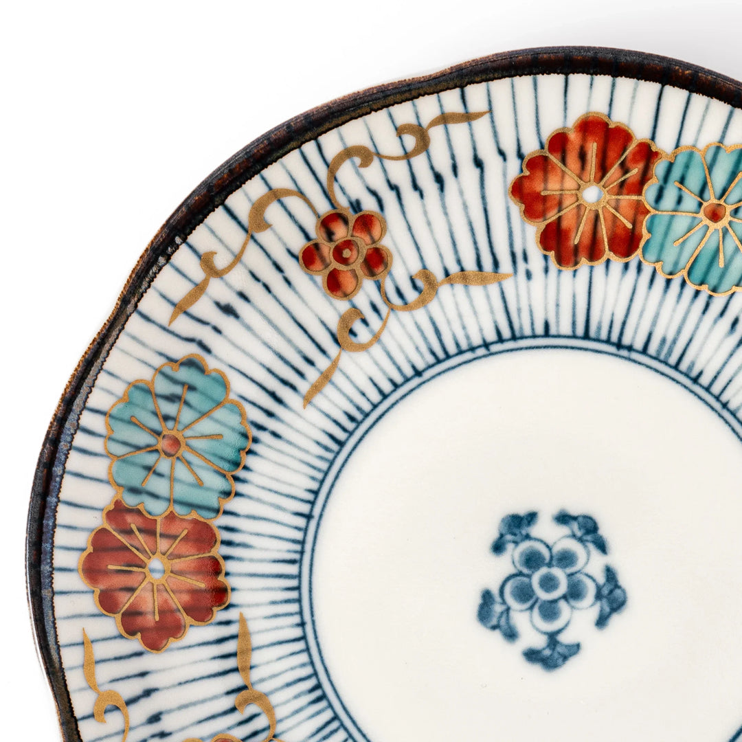 Scalloped Japanese dessert plate with blue stripes red teal and gold floral motifs perfect for small treats.