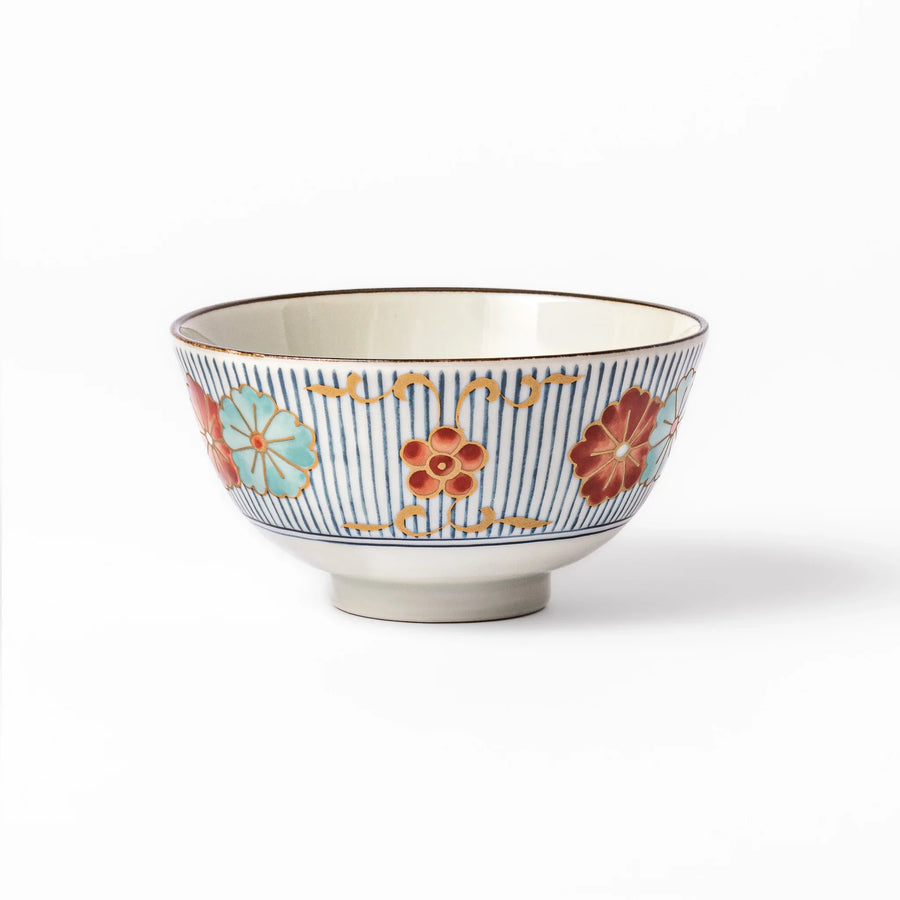 Traditional Japanese rice bowl with blue stripes and red teal and gold floral motifs perfect for bright everyday meals.