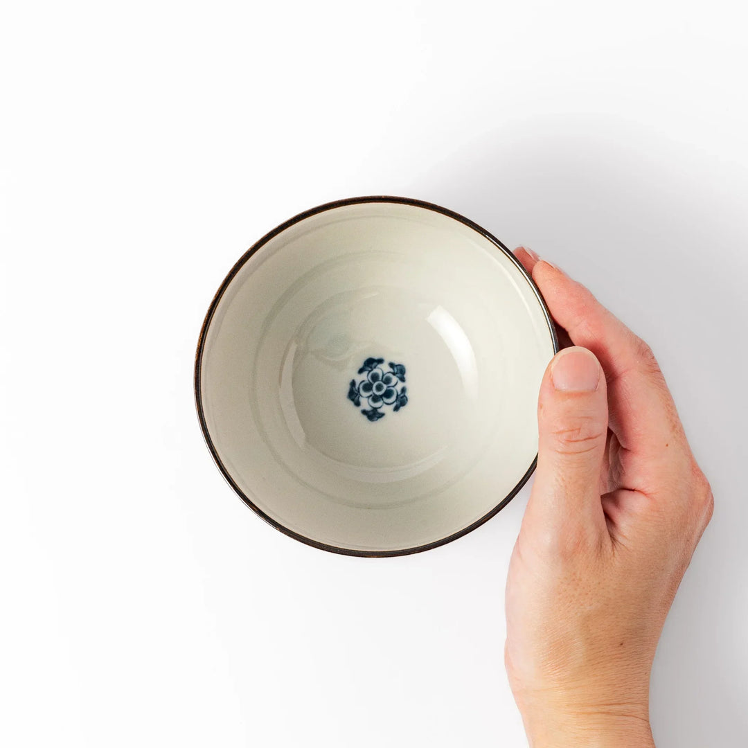 Traditional Japanese rice bowl with blue stripes and red teal and gold floral motifs perfect for bright everyday meals.